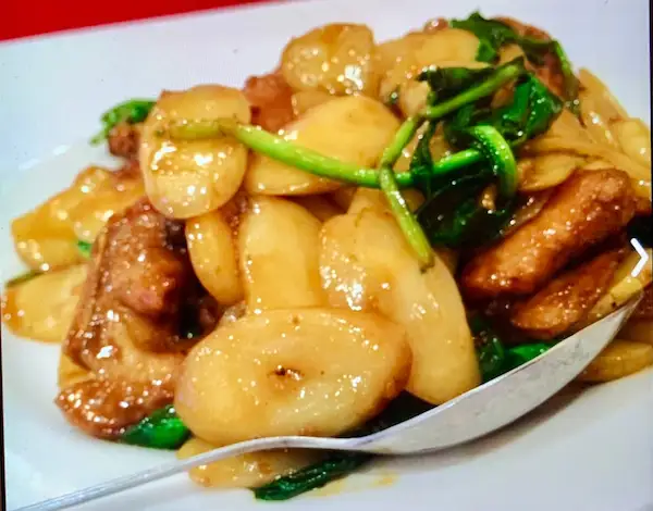 Stir-Fried Rice Cake Slices with Greens